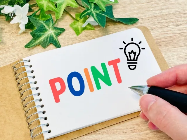 pointと書かれたノートとペン