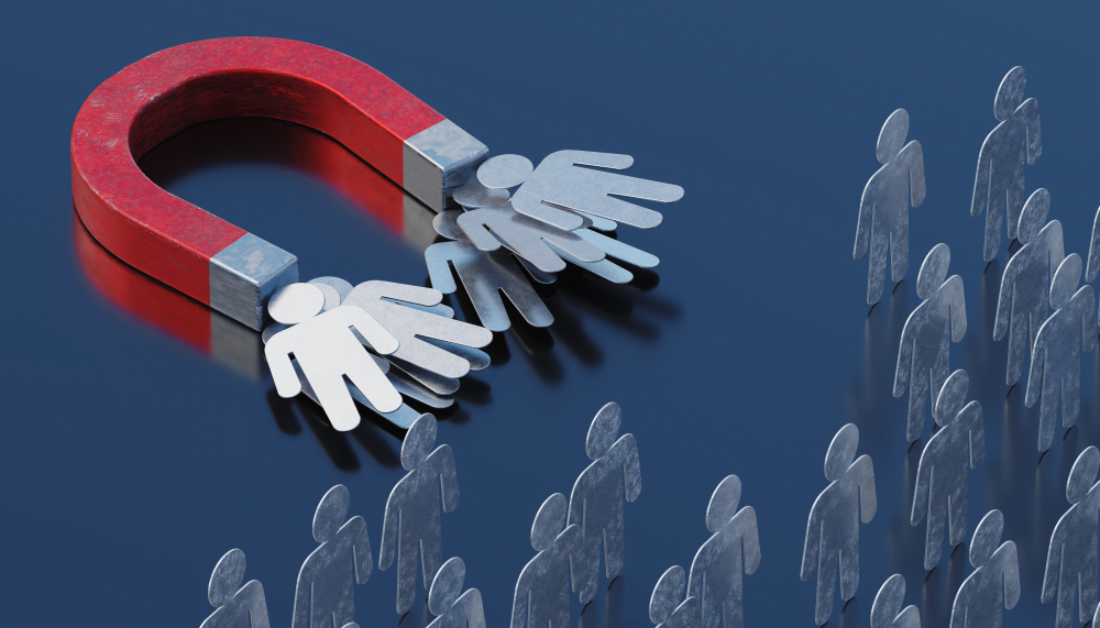 マグネットに２方向へ引き寄せられている人たち